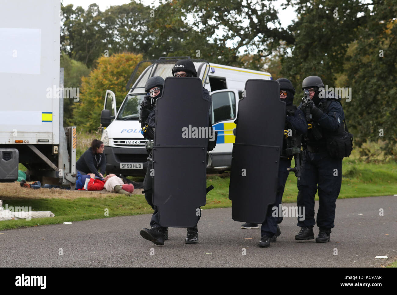 Police officers taking part in a counter-terrorism exercise responding to a scenario simulating a vehicle attack held in the grounds of the Royal Bank of Scotland headquarters at Gogarburn in Edinburgh. Stock Photo