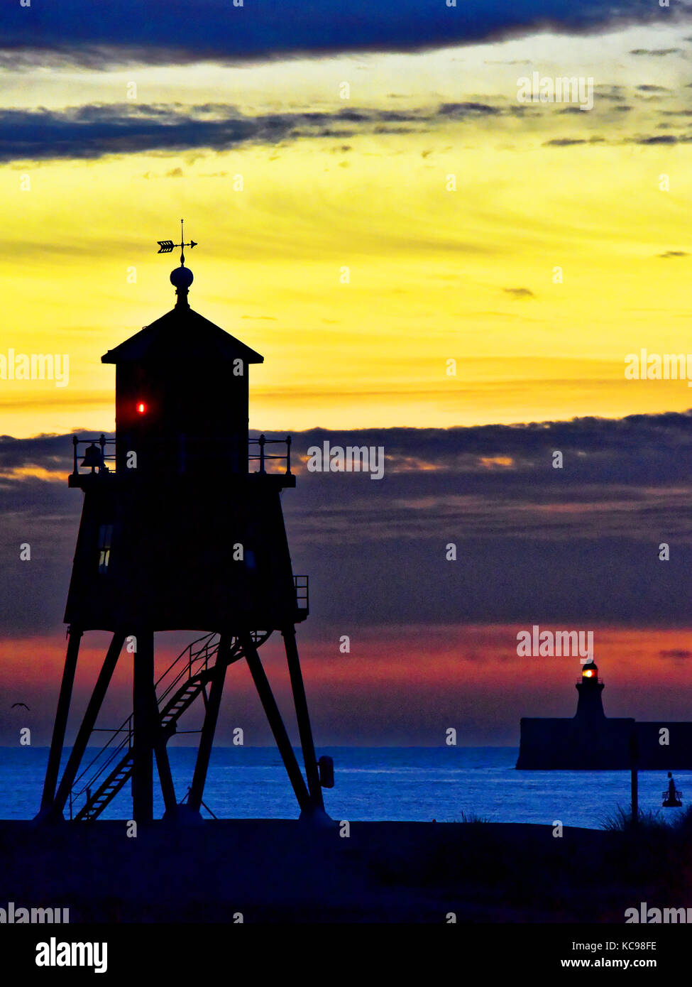 Dawn off the Herd Groyne and South pier lighthouses river Tyne South Shields Stock Photo