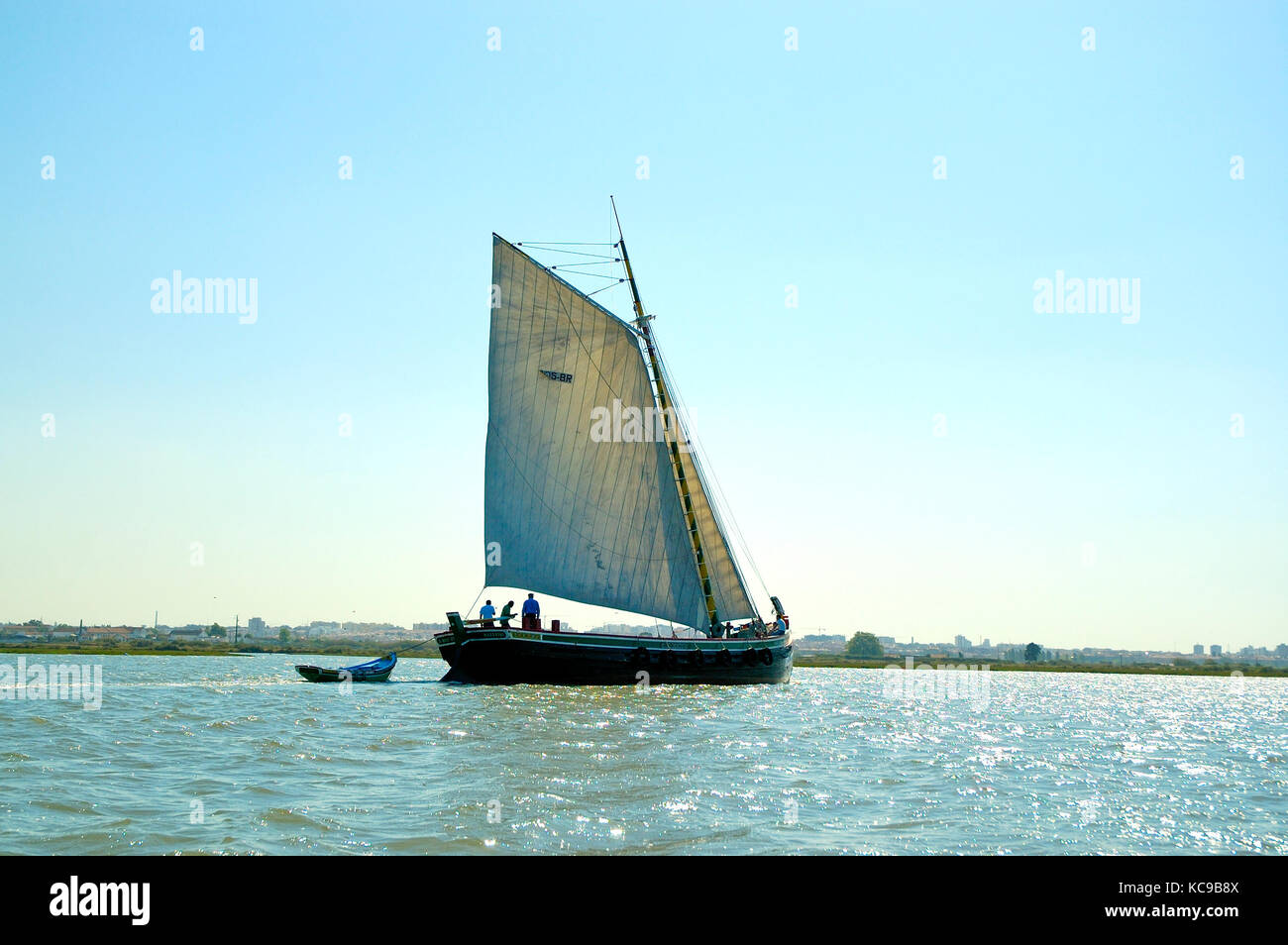 Traditional boat sailing in the Tagus river. Portugal Stock Photo
