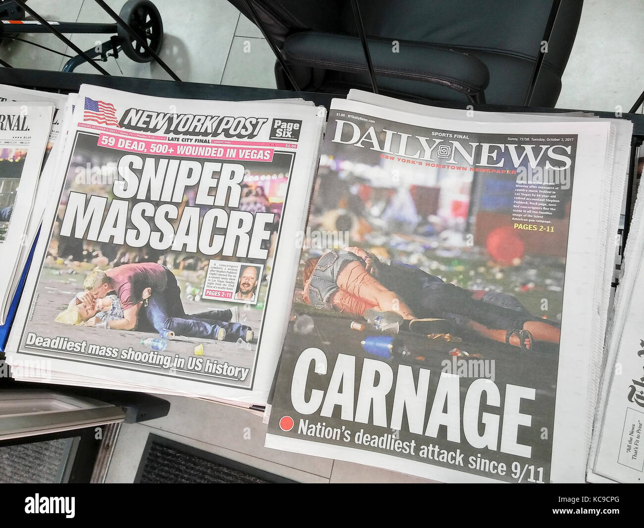 Front pages of New York newspapers on Tuesday, October 3, 2017 report on the shooting by Stephen Paddock in Las Vegas from his room at the Mandalay Bay hotel during a country music concert which resulted in 59 fatalities so far and 527 injured.  The shooting was the worst mass murder in US history. (© Richard B. Levine) Stock Photo