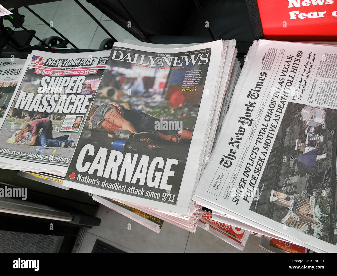 Front pages of New York newspapers on Tuesday, October 3, 2017 report on the shooting by Stephen Paddock in Las Vegas from his room at the Mandalay Bay hotel during a country music concert which resulted in 59 fatalities so far and 527 injured.  The shooting was the worst mass murder in US history. (© Richard B. Levine) Stock Photo