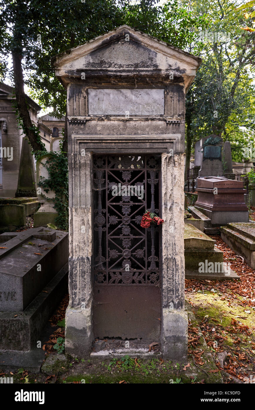 A worn and weathered tomb in Pere Lachaise cemetery, Paris, France. Stock Photo