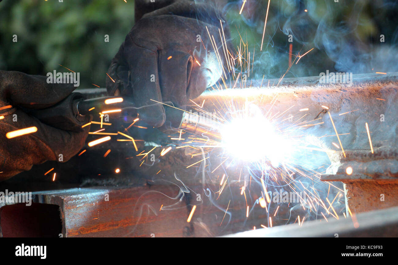 Welding work.sparks and smoke of a welding work,image of a Stock Photo