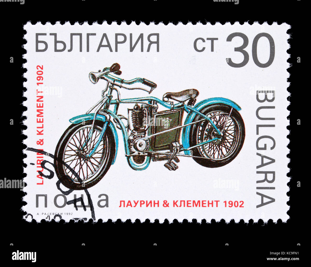 POstage stamp from Bulgaria depicting a 1902 Laurin and Klement motorcycle. Stock Photo