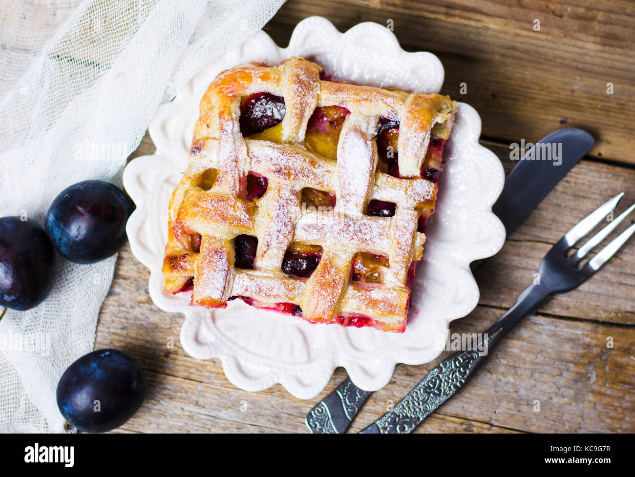 Sweet baked fruit pie with sugar on a tray Stock Photo