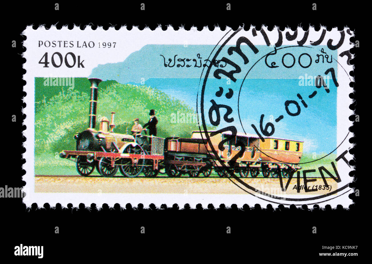 Postage stamp from Laos depicting the steam locomotive Adler from 1835 and some passenger cars. Stock Photo