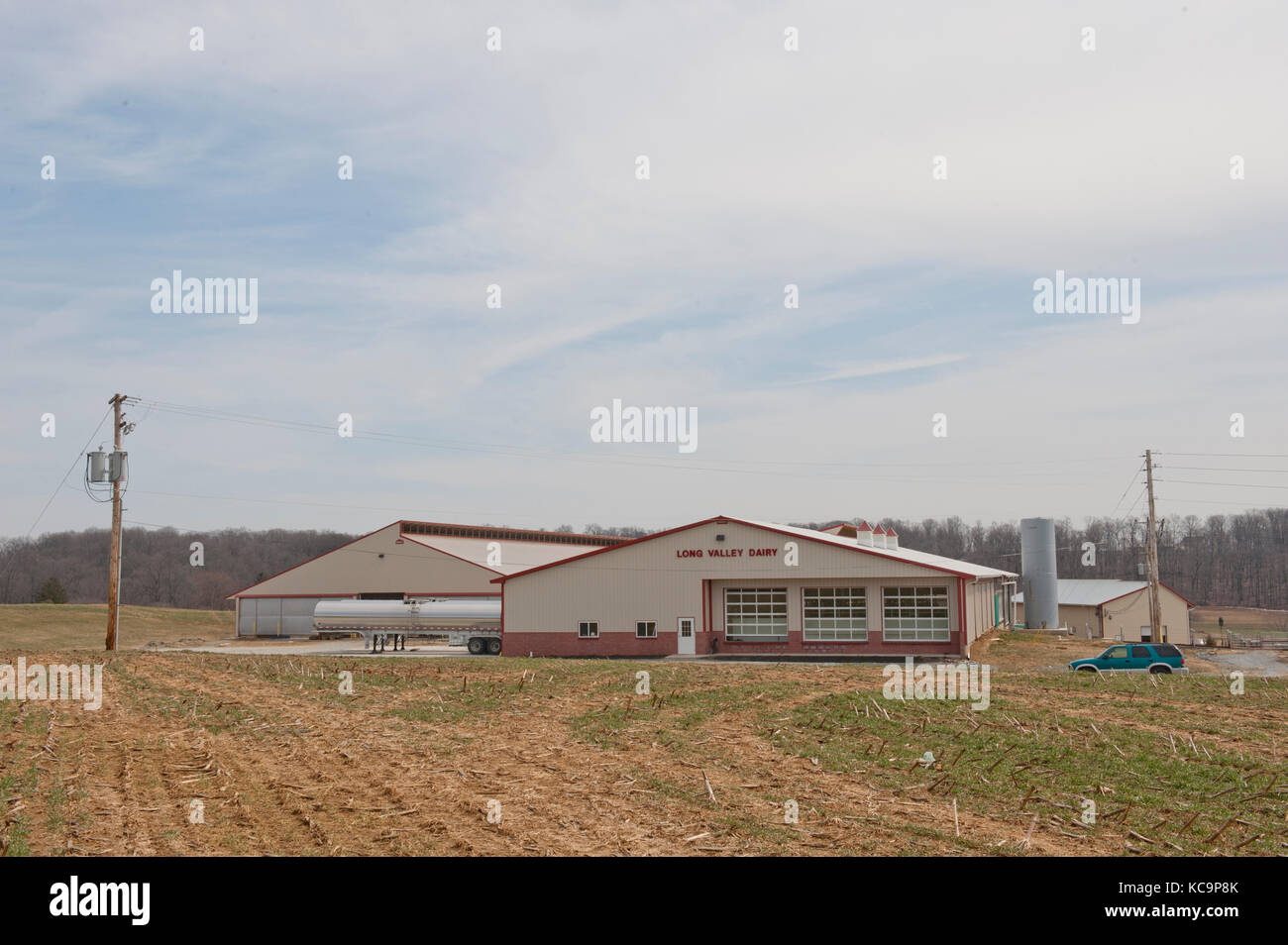 Milking Parlor And Freestall Barn Buildings At Dairy Farm Stock