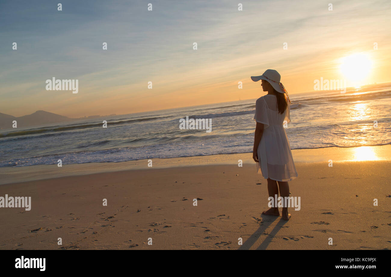 Woman on Milnerton beach, Cape Town, Western Cape, South Africa Stock Photo