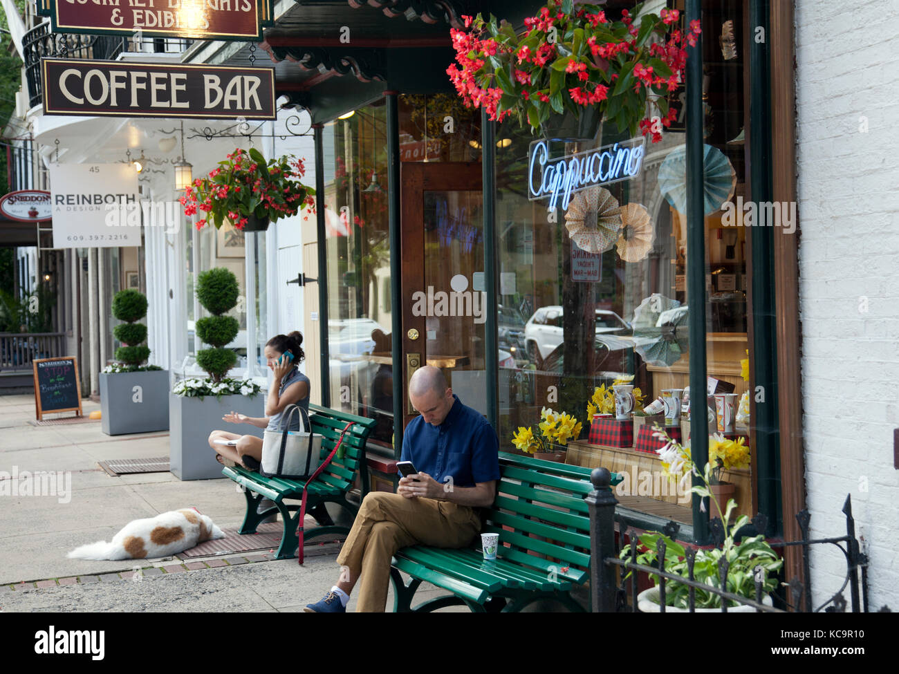People Sitting On Benches Outside Cafe In Lambertville Nj Usa