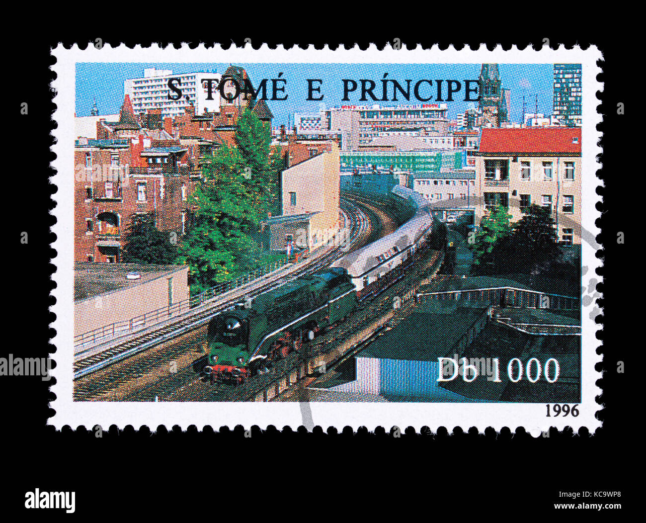 Postage stamp from the St. Thomas and Prince Islands depicting a train in an urban environment Stock Photo
