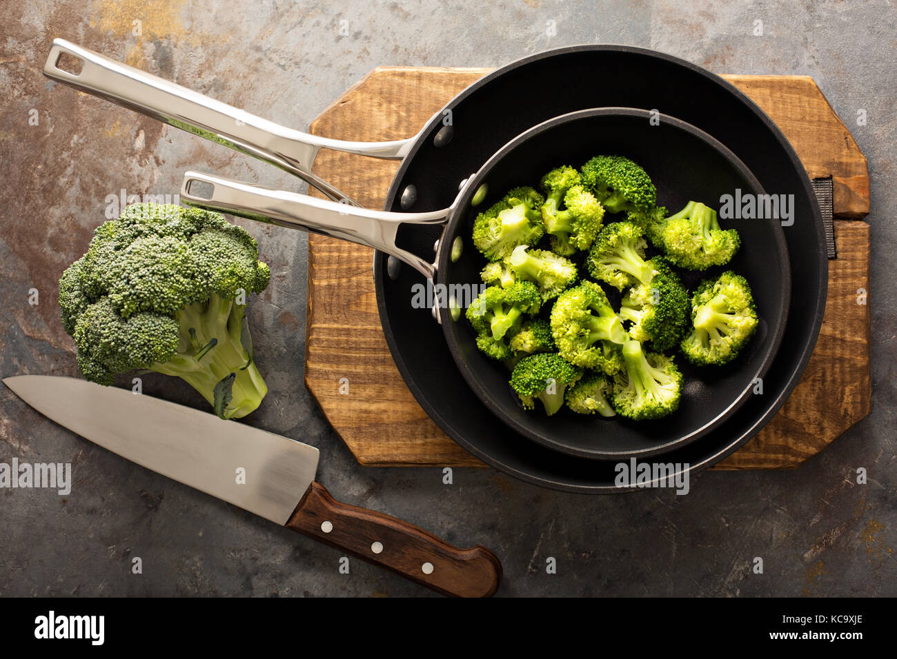 Steamed or stewed broccoli in a skillet Stock Photo