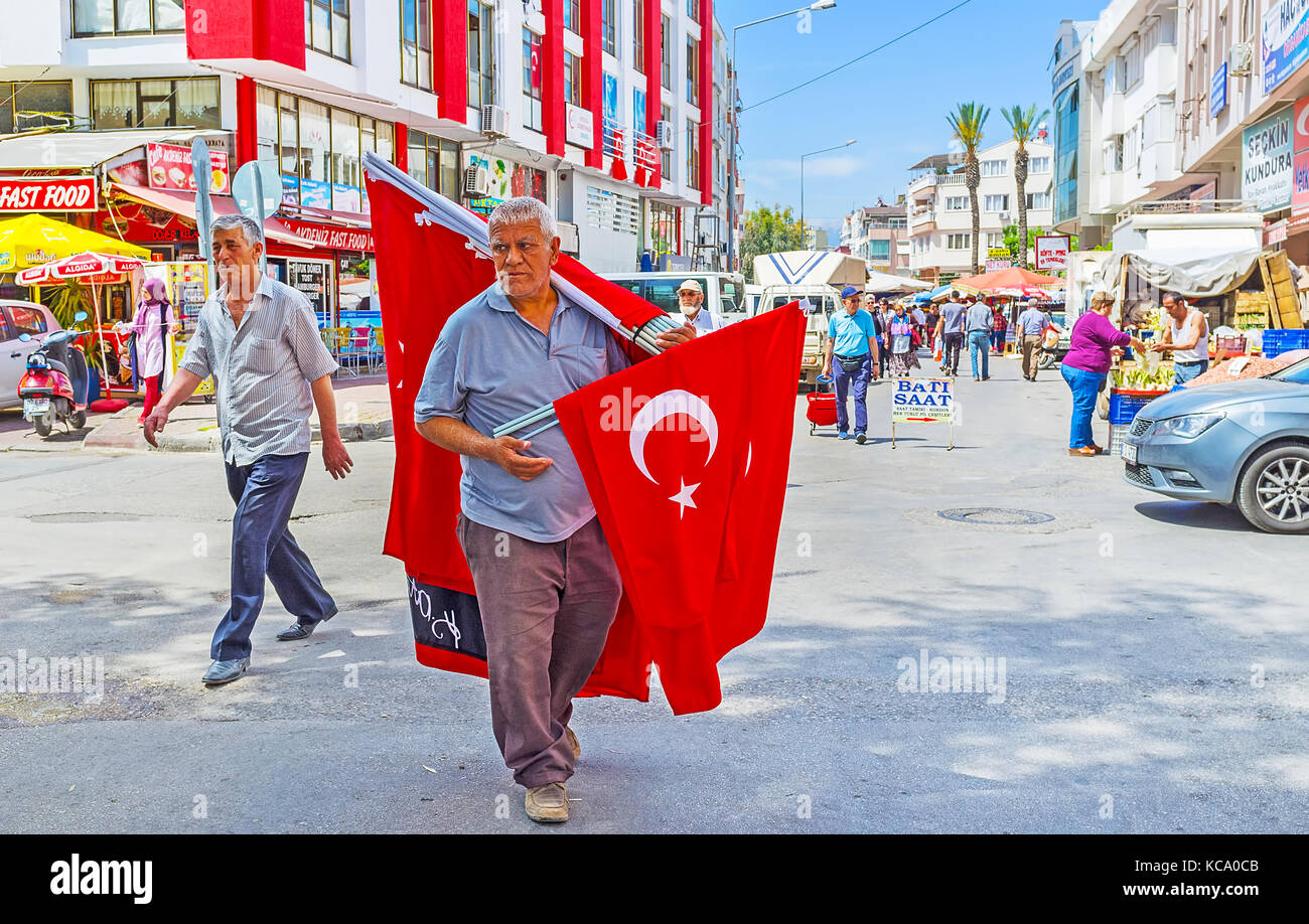 ANTALYA, TURKEY - MAY 12, 2017: The street vendor sells the flags in a shopping district, on May 12 in Antalya. Stock Photo