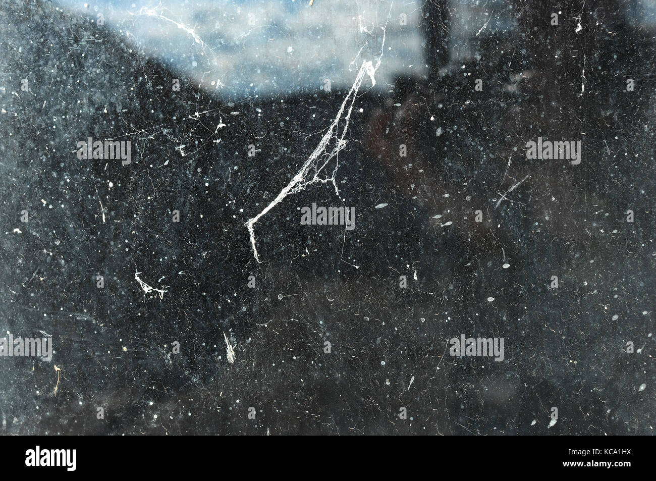 Texture of dirty window glass with web and dust close-up Stock Photo