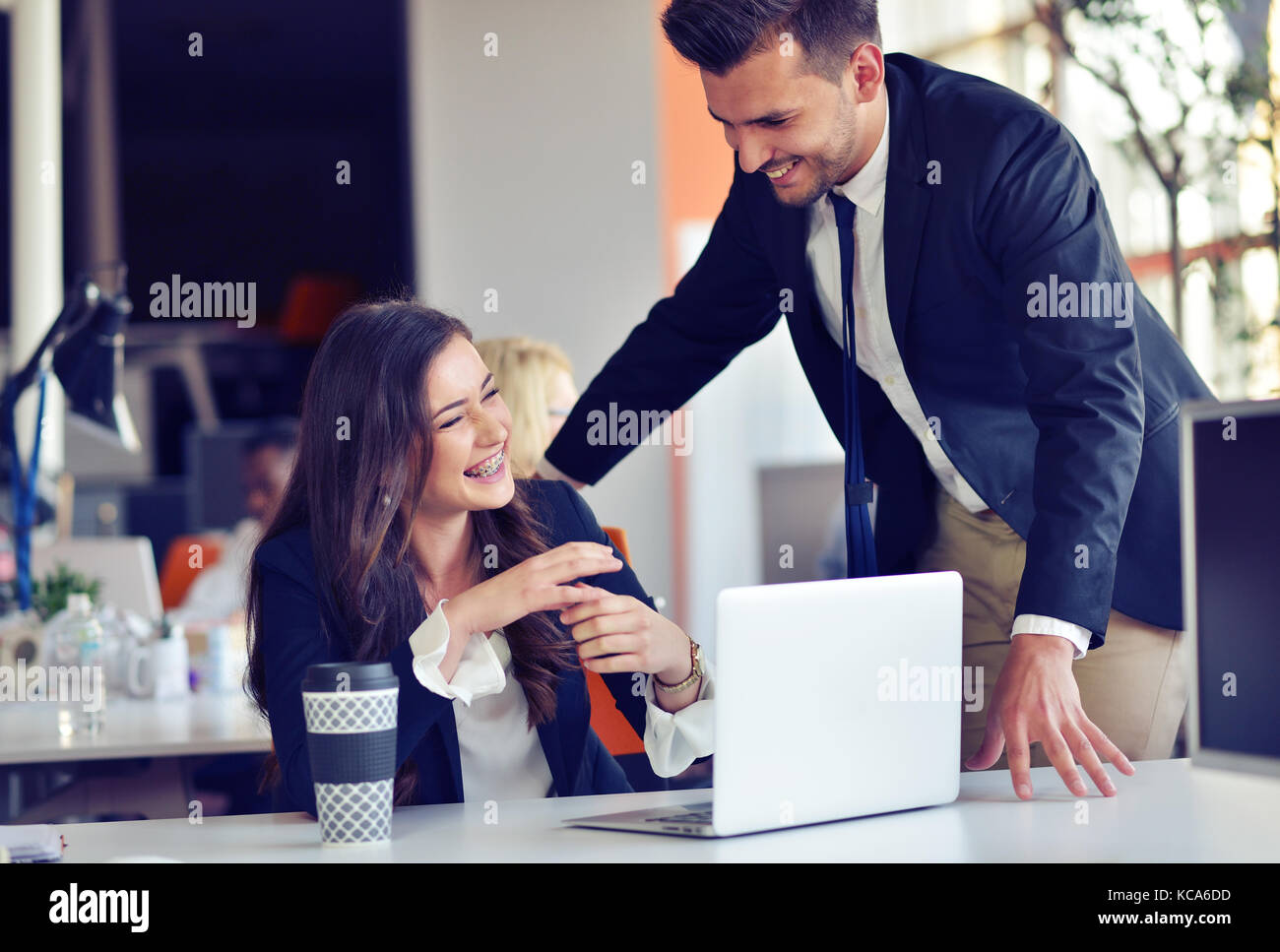 startup business concept with young multiethnic couple in modern office working on laptop Stock Photo