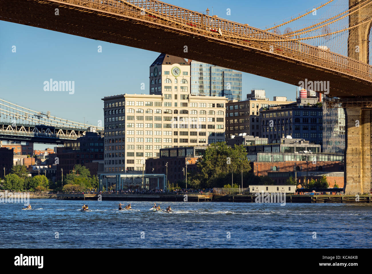 Brooklyn Riverfront with the Brooklyn Bridge and main Street Park. DUMBO, New York City Stock Photo