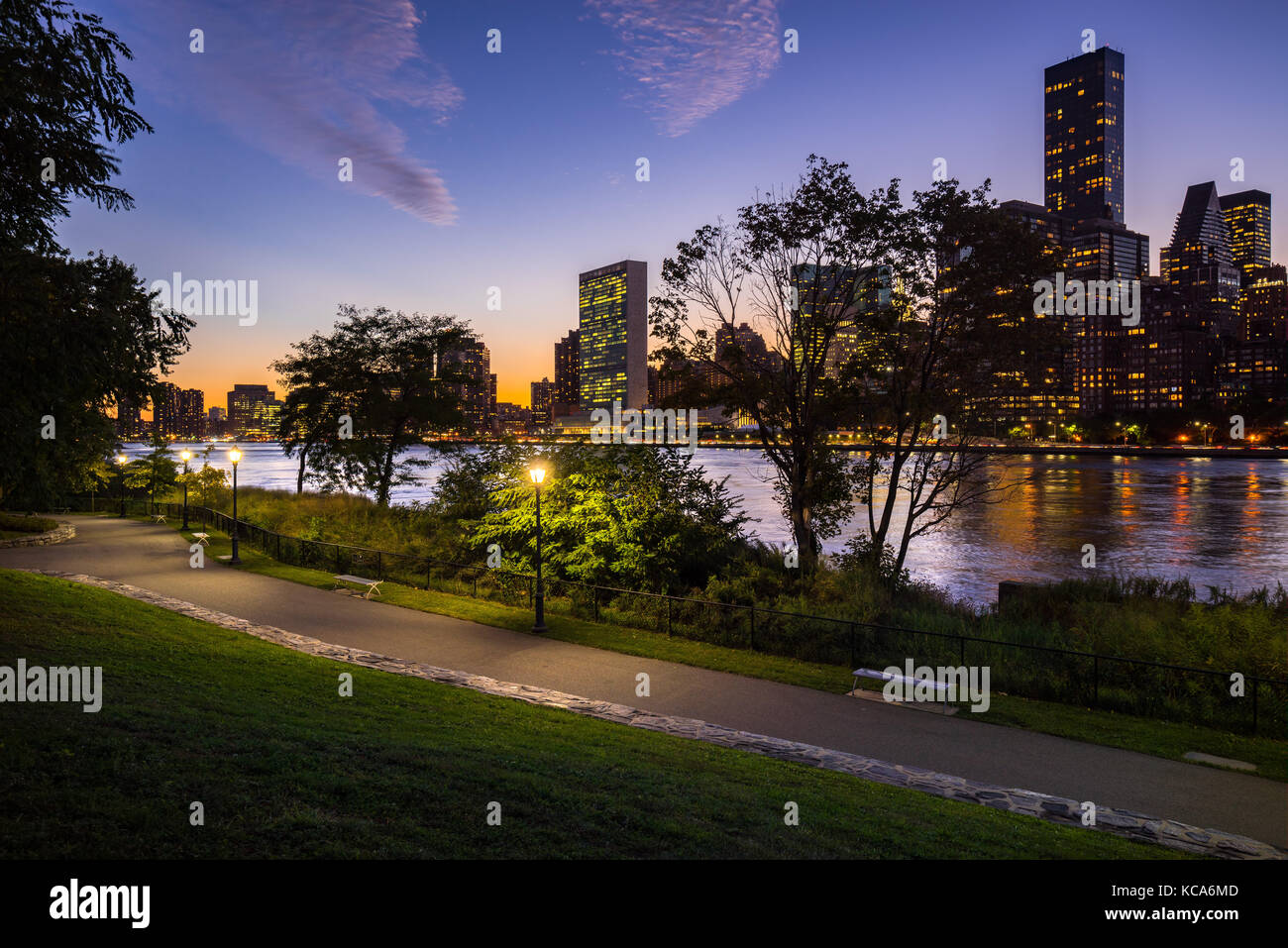 Summer evening view on Manhattan Midtown East from Roosevelt Island with the East River. New York City Stock Photo