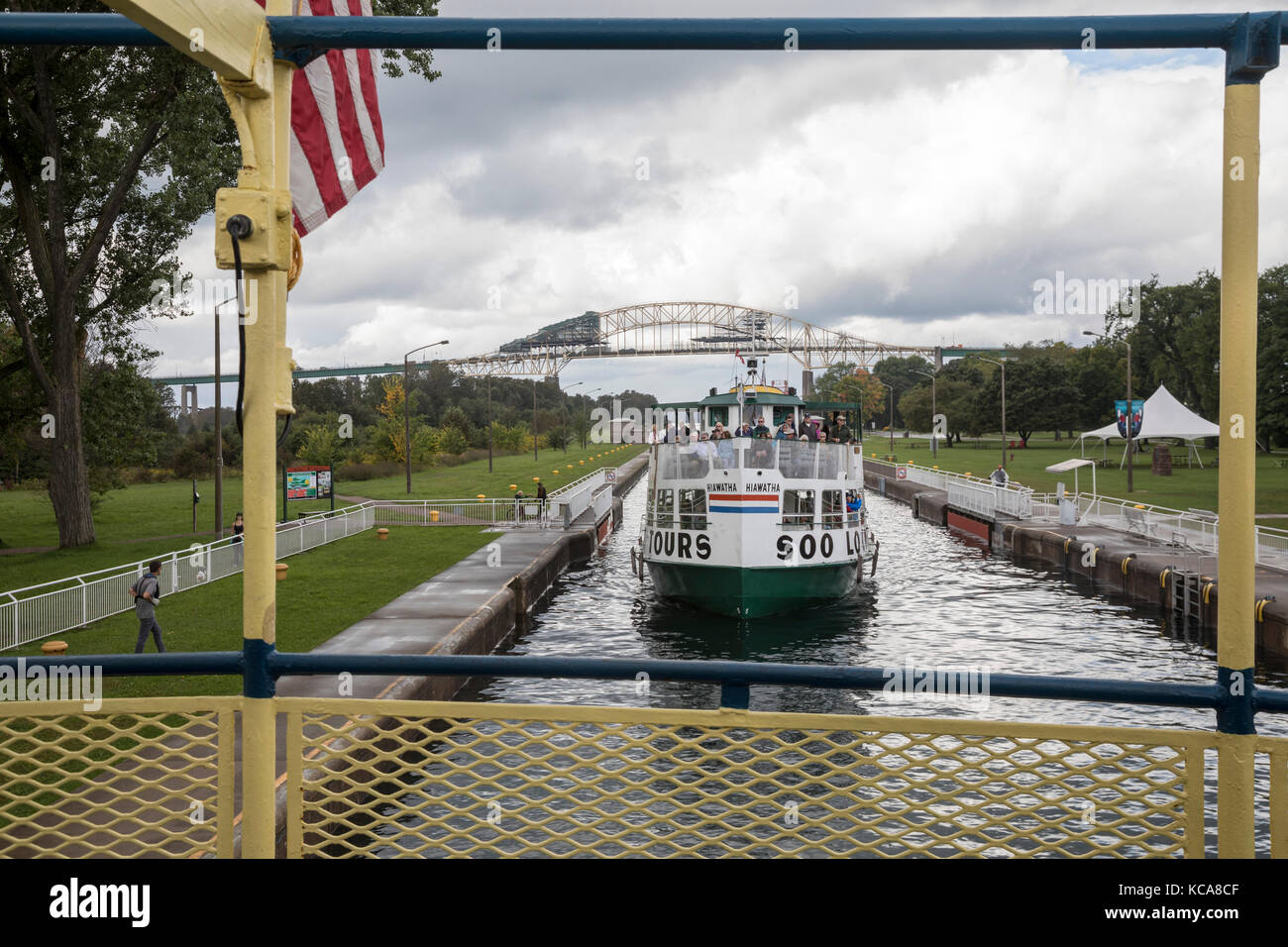 Sault Ste Marie, Ontario Canada - Tourists on a boat tour of the Soo Locks as the boat passes through the Canadian lock. The small Canadian lock is us Stock Photo