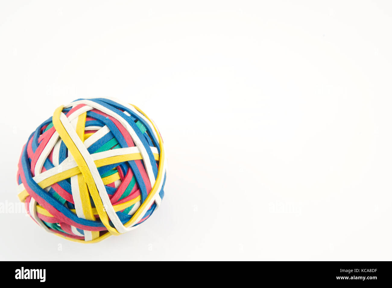 Rubber band ball made from many colourful elastic bands isolated on a