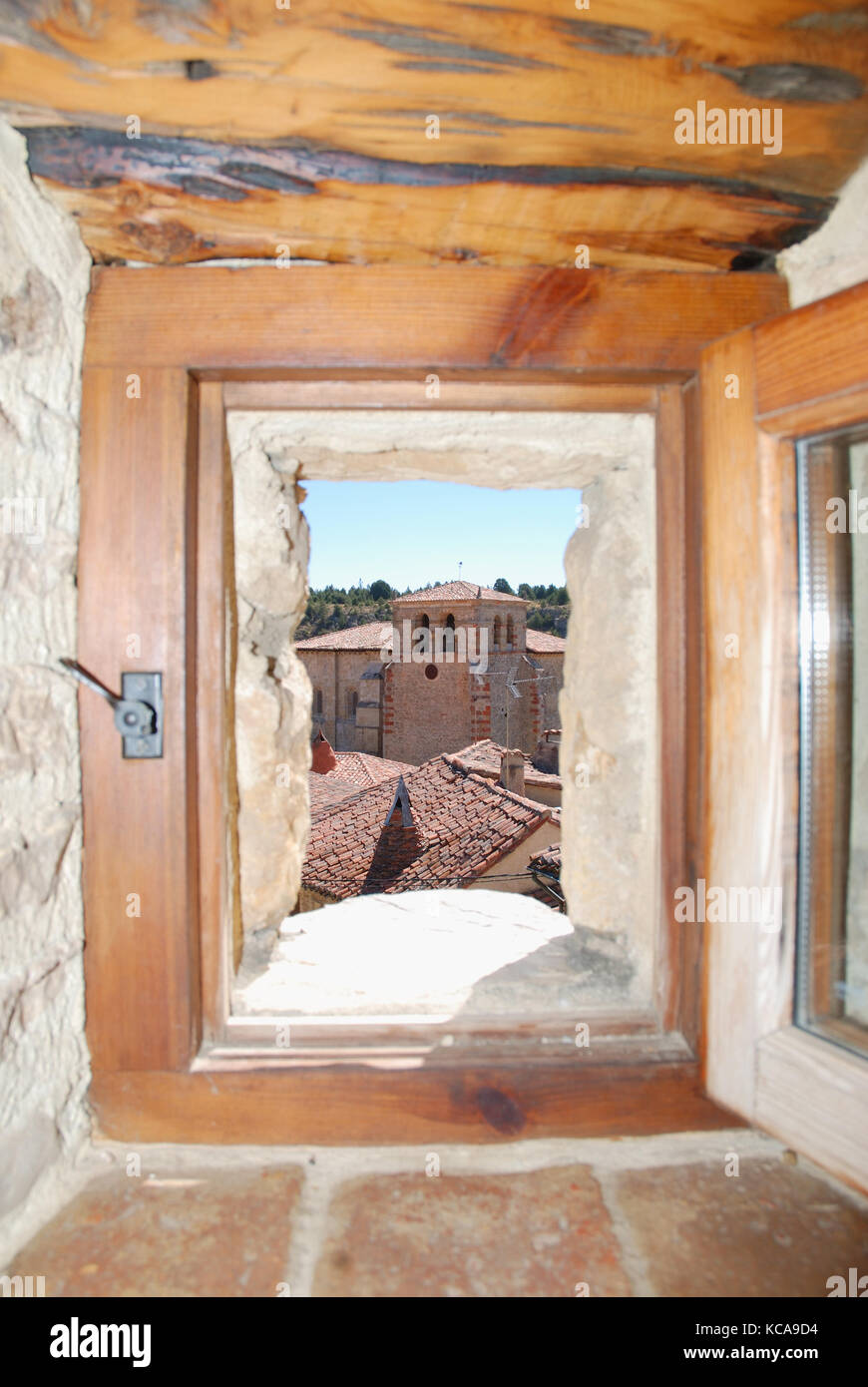 View of the village through an open window. Calatañazor, Soria province, Castilla Leon, Spain. Stock Photo