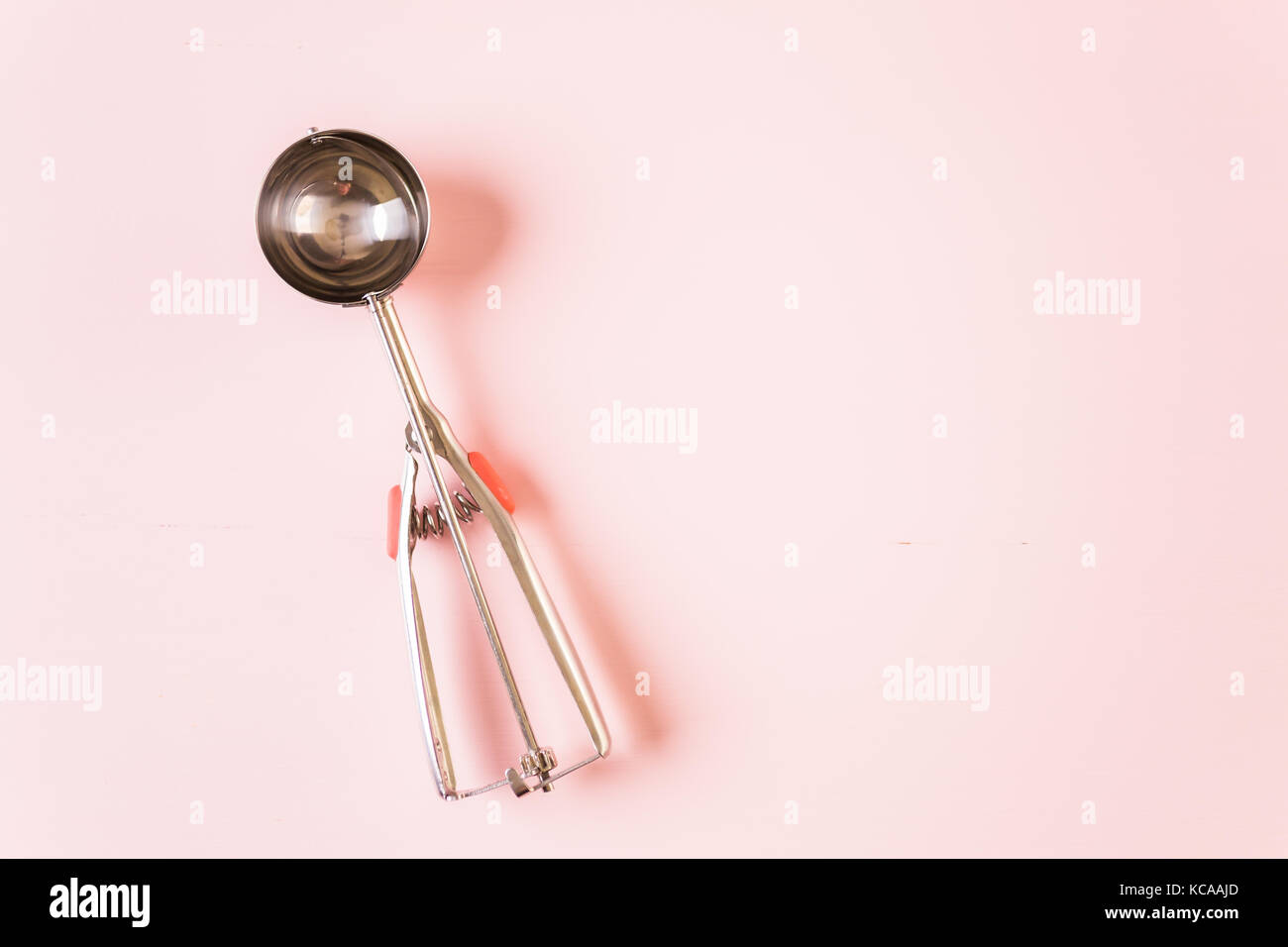 ice cream scoop on a pink background Stock Photo - Alamy