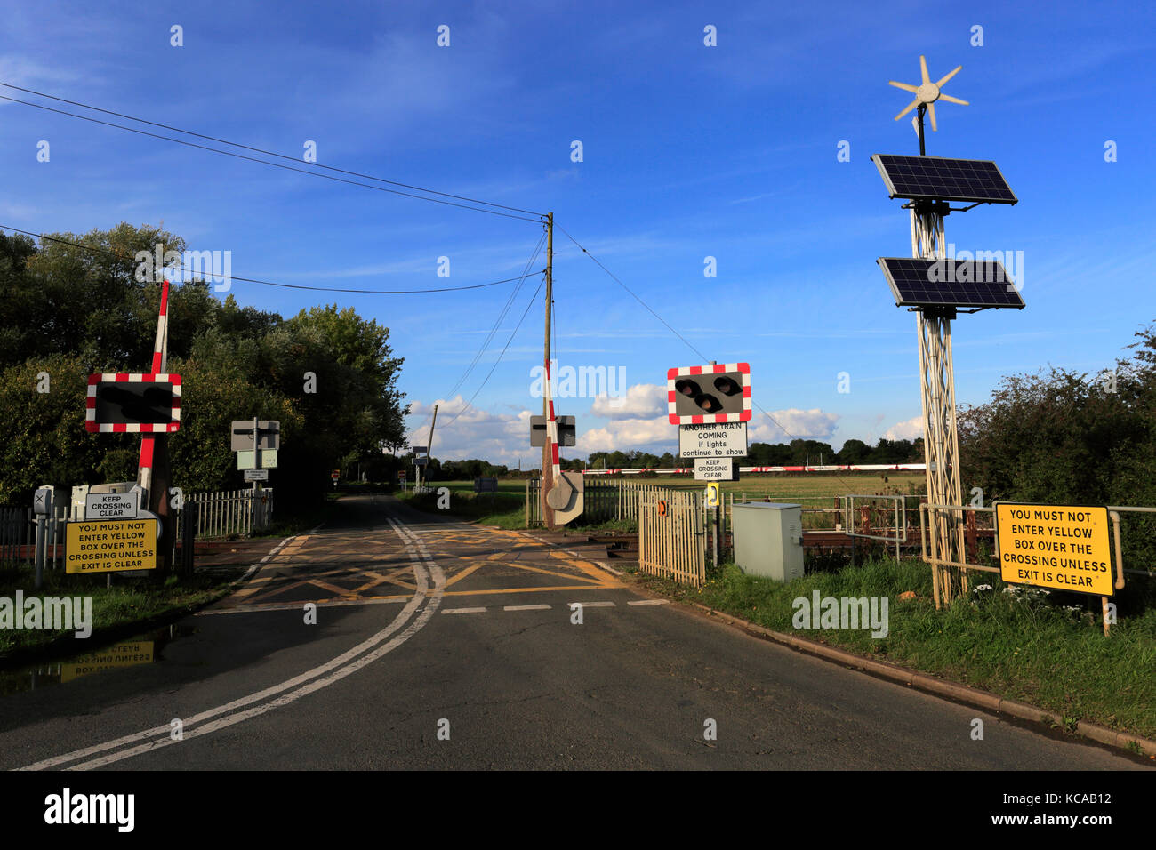 An unmanned Level crossing, East Coast Main Line Railway, Peterborough, Cambridgeshire, England, UK Stock Photo
