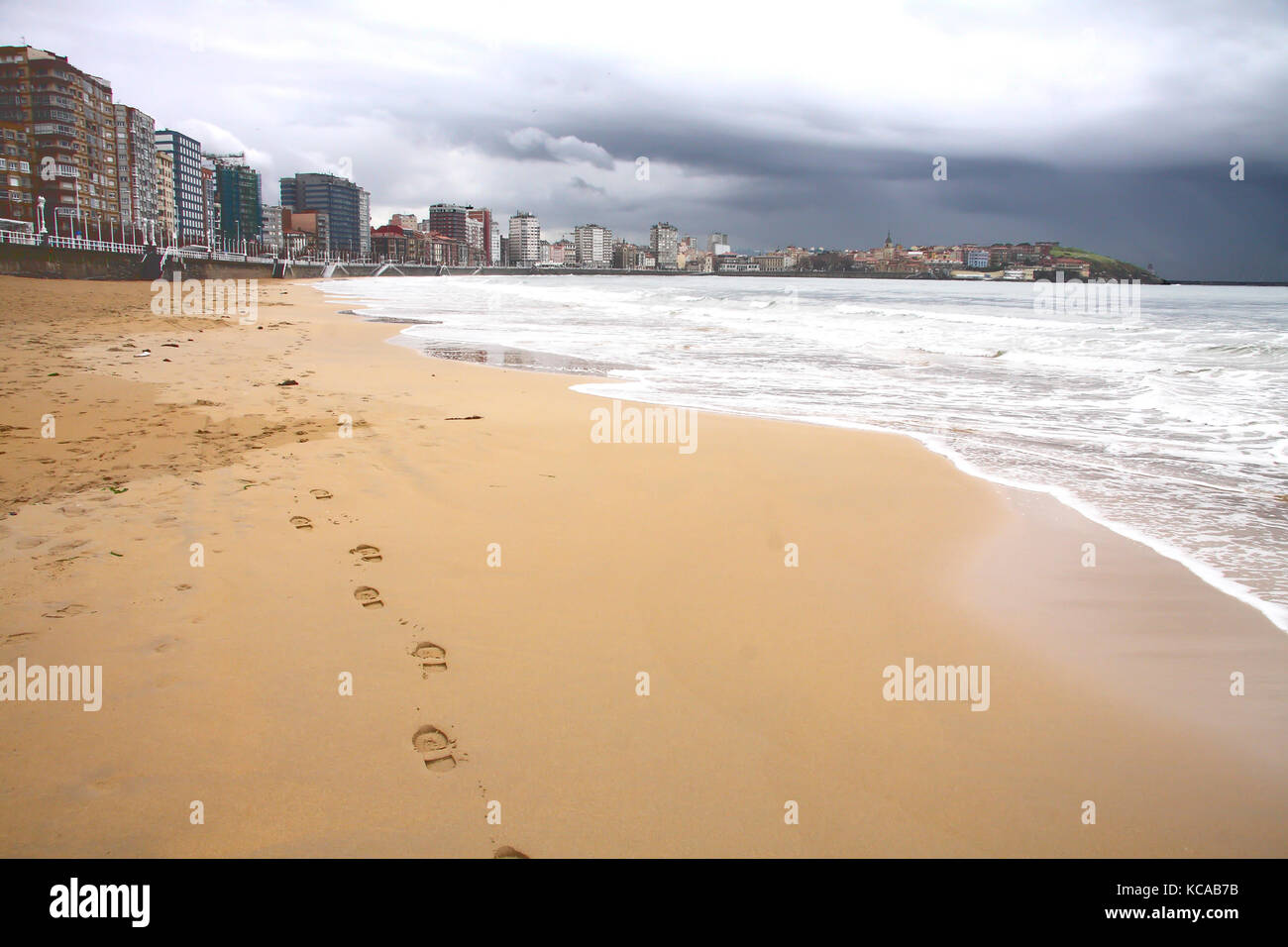 Foot prints in San Lorenzo beach at Gijon, Asturias, Spain. Stock Photo