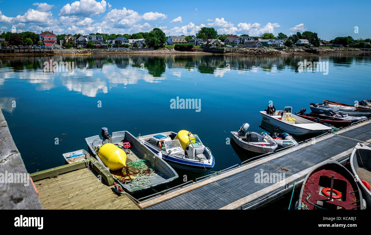 Small recreational watercraft and fishing boats tied to a dock, St. Andrews, NB, Canada Stock Photo