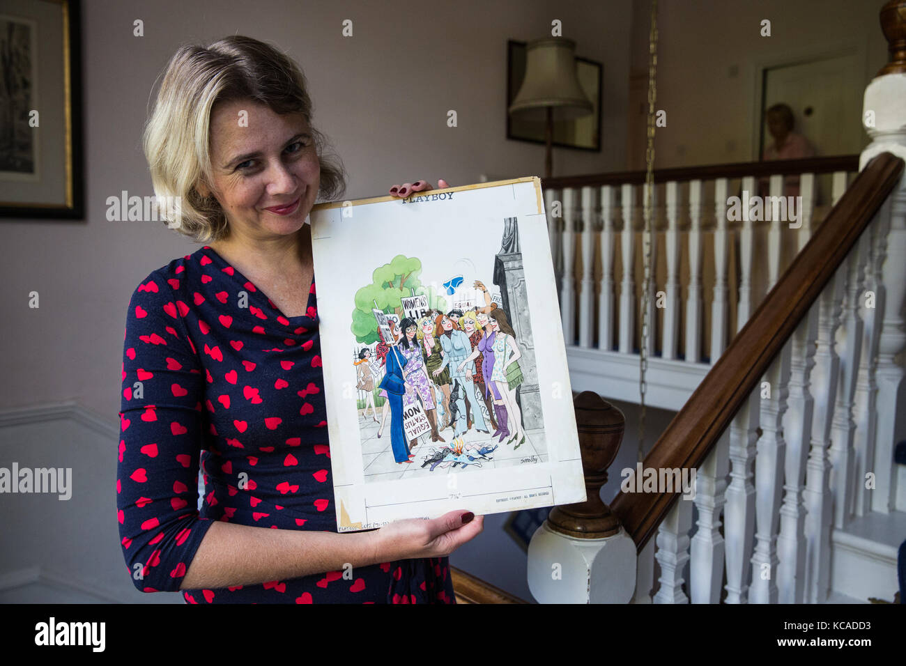 Bromley, UK. 3rd October, 2017. Auctioneer Catherine Southon poses with a cartoon by Smilby (Francis Wilford-Smith, 1927-2009), one of the most successful cartoonists of his day and best known for his work for Playboy and Punch. Part 1 of the Smilby Cartoon Collection will be auctioned by Catherine Southon Auctioneers & Valuers on 1st November 2017. Credit: Mark Kerrison/Alamy Live News Stock Photo