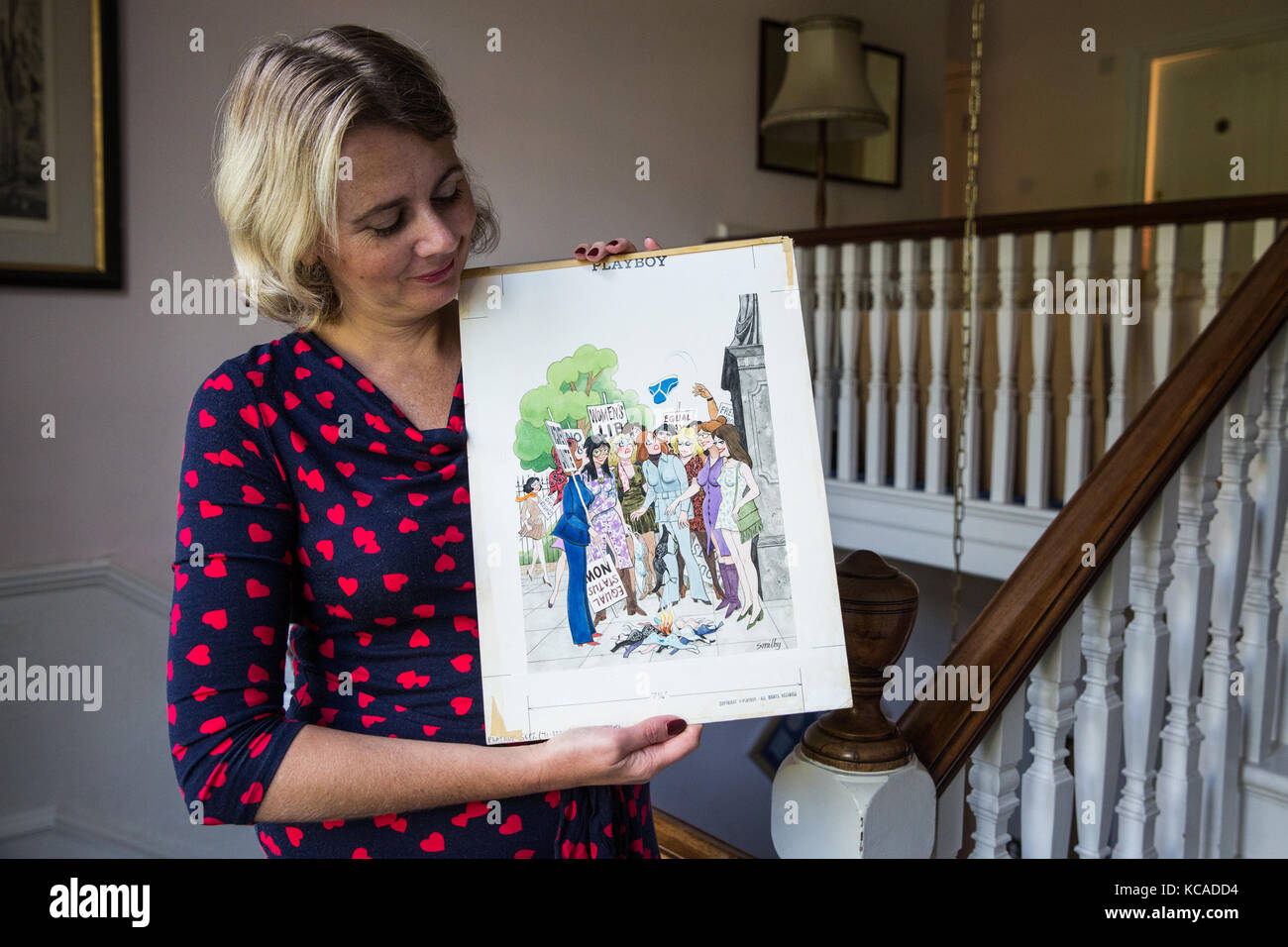 Bromley, UK. 3rd October, 2017. Auctioneer Catherine Southon poses with a cartoon by Smilby (Francis Wilford-Smith, 1927-2009), one of the most successful cartoonists of his day and best known for his work for Playboy and Punch. Part 1 of the Smilby Cartoon Collection will be auctioned by Catherine Southon Auctioneers & Valuers on 1st November 2017. Credit: Mark Kerrison/Alamy Live News Stock Photo