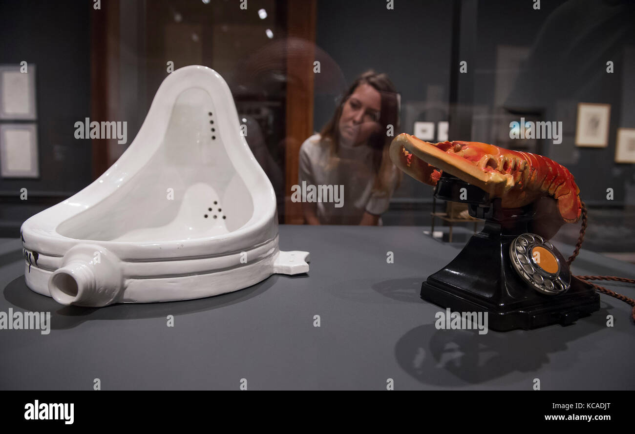 Royal Academy of Arts, London, UK. 3 October 2017. Two iconic works of the 20th century: Marcel Duchamp's Fountain, 1917/1964 and Salvador Dalí's Lobster Telephone, 1938 at the Royal Academy of Arts in an exhibition exploring the aesthetic and personal links between the two artists. The Dalí/Duchamp exhibition runs from 7 October 2017 - 3 January 2018. Duchamp's Fountain, 1917/1964 is on loan from the National Gallery of Modern and Contemporary Art, Rome. Dalí's Lobster Telephone, 1938 is on loan from West Dean College, West Sussex. Credit: Malcolm Park/Alamy Live News. Stock Photo