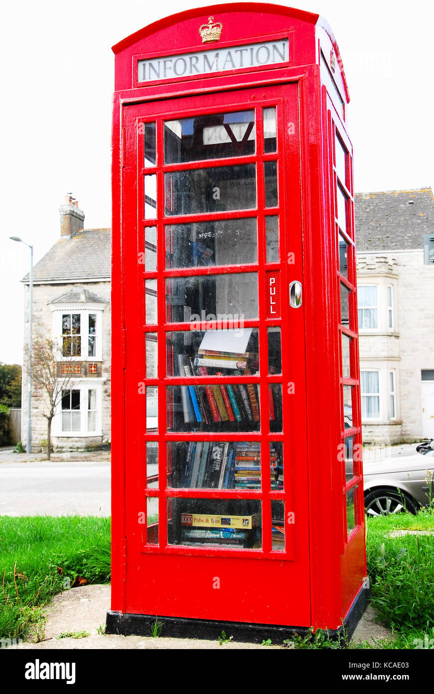 Wakeham, Dorset, UK. 3rd October 2017 - The former GPO telephone kiosk in Wakeham, Isle of Portland, which has been converted into what could possibly be the world's smallest tourist information office. Faced with its removal, residents clubbed together to buy it and have just sealed the deal with a fresh coat of shiny red paint! Credit: stuart fretwell/Alamy Live News Stock Photo
