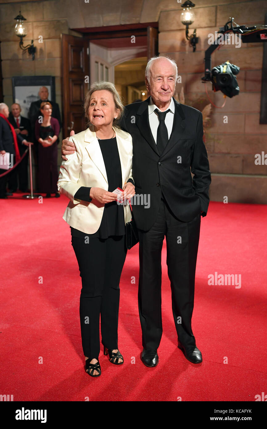 Berlin, Germany. 3rd Oct, 2017. Actor Armin Mueller-Stahl and his wife Gabriele Scholz arrive at the reopening of the Berliner Staatsoper Unter den Linden in Berlin, Germany, 3 October 2017. Credit: Bernd Von Jutrczenka/dpa/Alamy Live News Stock Photo