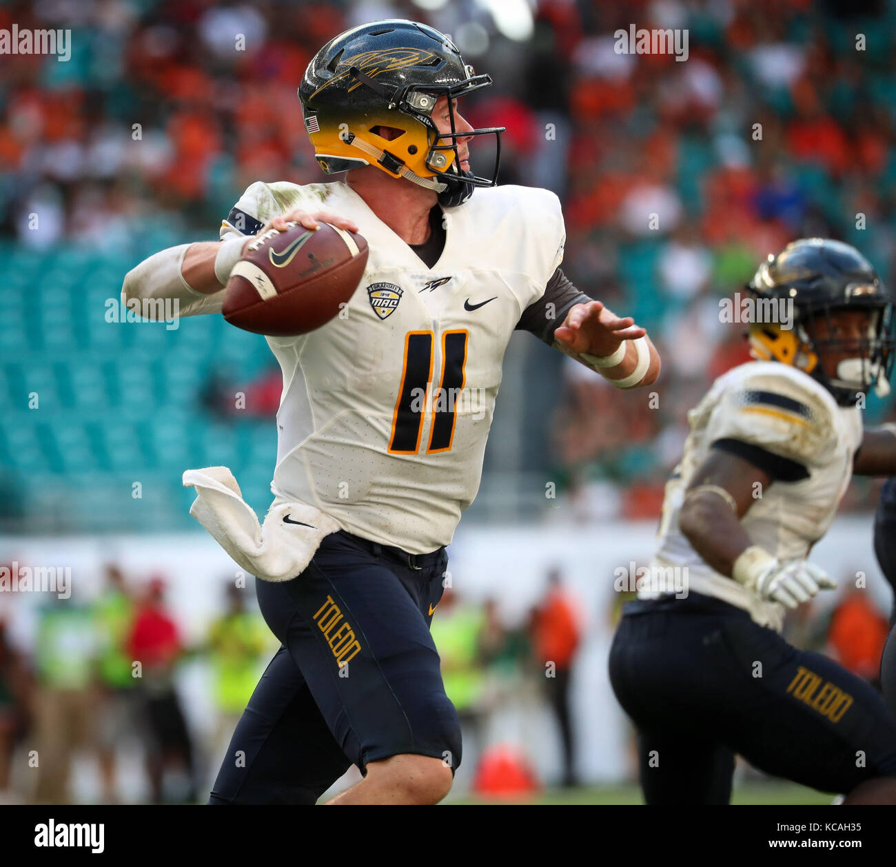 Miami Gardens, Florida, USA. 23rd Sep, 2017. Toledo Rockets quarterback Logan Woodside (11) sets up to pass the ball during the college football game between the Toledo Rockets and the Miami Hurricanes at the Hard Rock Stadium in Miami Gardens, Florida. Miami won 52-30. Mario Houben/CSM/Alamy Live News Stock Photo