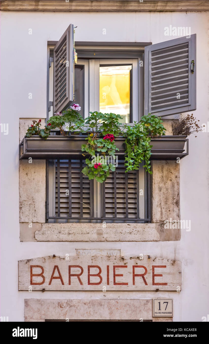 Old window in Rome, and barber shop Stock Photo
