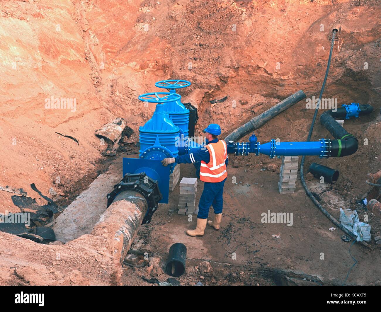 Main City water supply pipeline. Technical staff in reflective vest