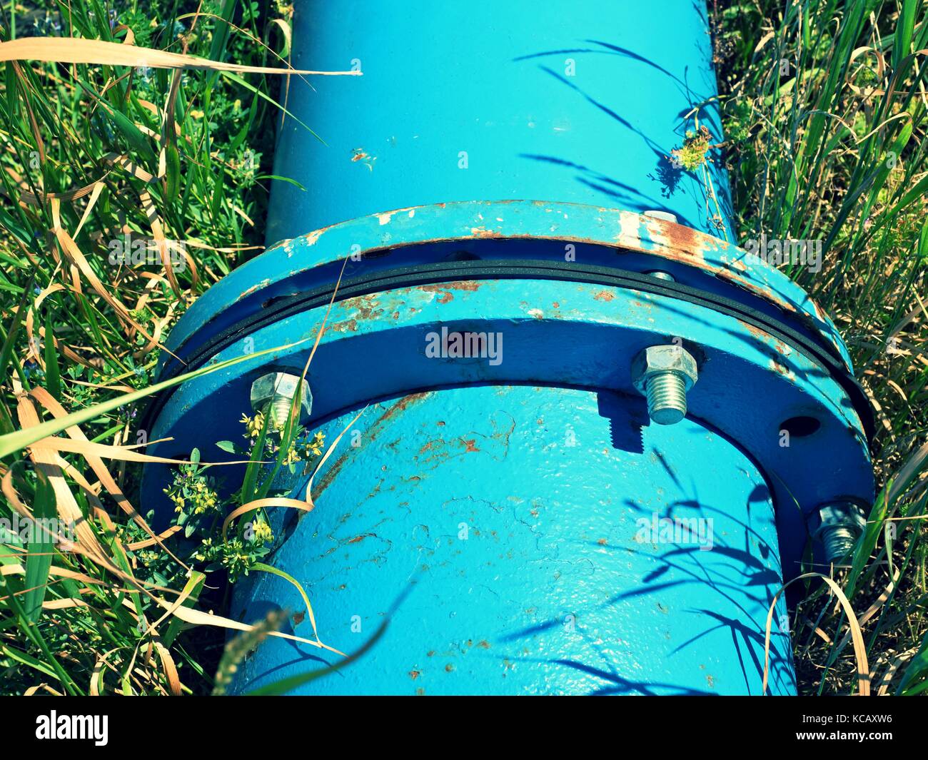 Repaired big drink water pipes joined with new blue flanges and silver