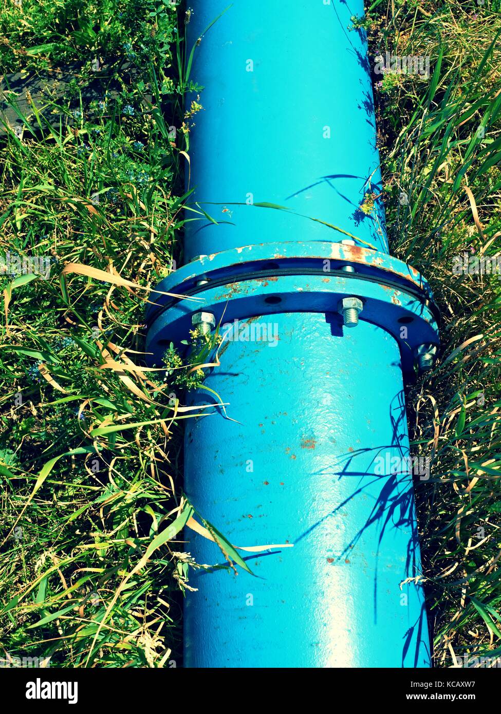 Repaired big drink water pipes joined with new blue flanges and silver