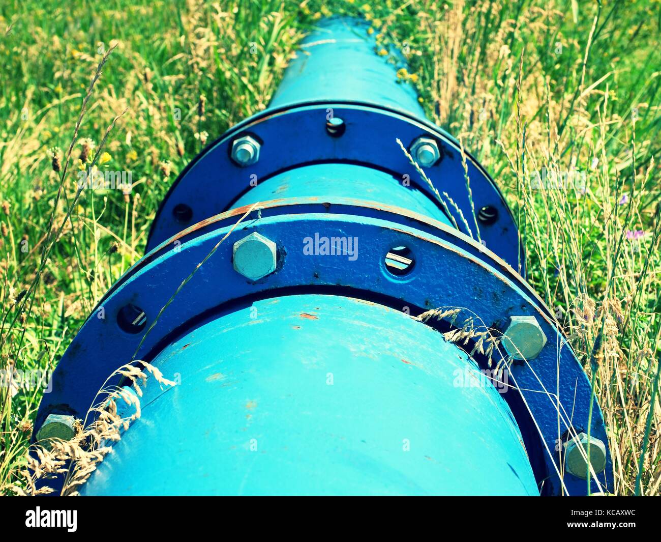 Repaired big drink water pipes joined with new blue flanges and silver