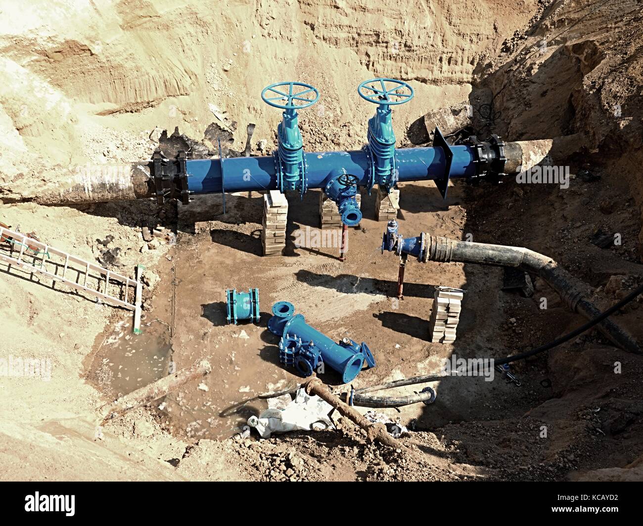 Oil, gas, water industry. Wellhead with valve armature underground. Dug