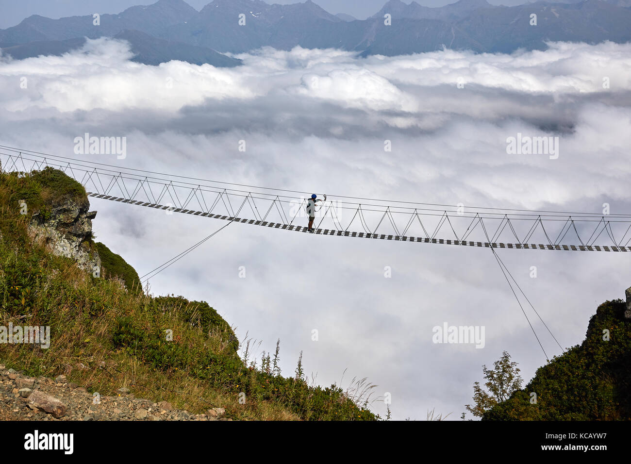 Man walking on suspension bridge hi-res stock photography and images ...