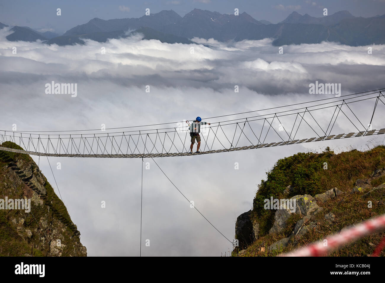 Man walking on suspension bridge hi-res stock photography and images ...