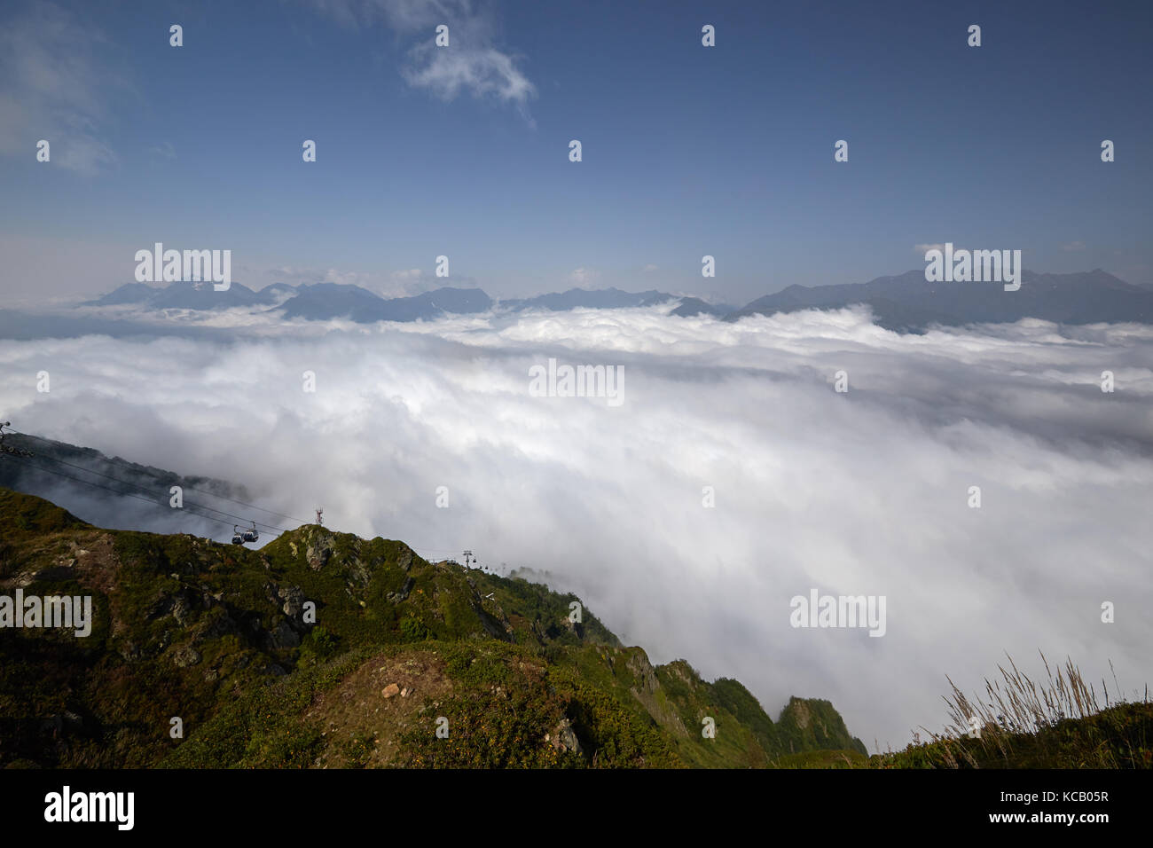 Beautiful clouds and fog among mountain landscape Stock Photo - Alamy
