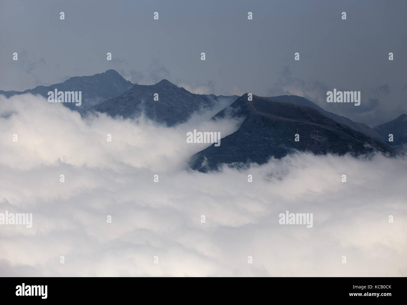 Beautiful clouds and fog among mountain landscape Stock Photo - Alamy