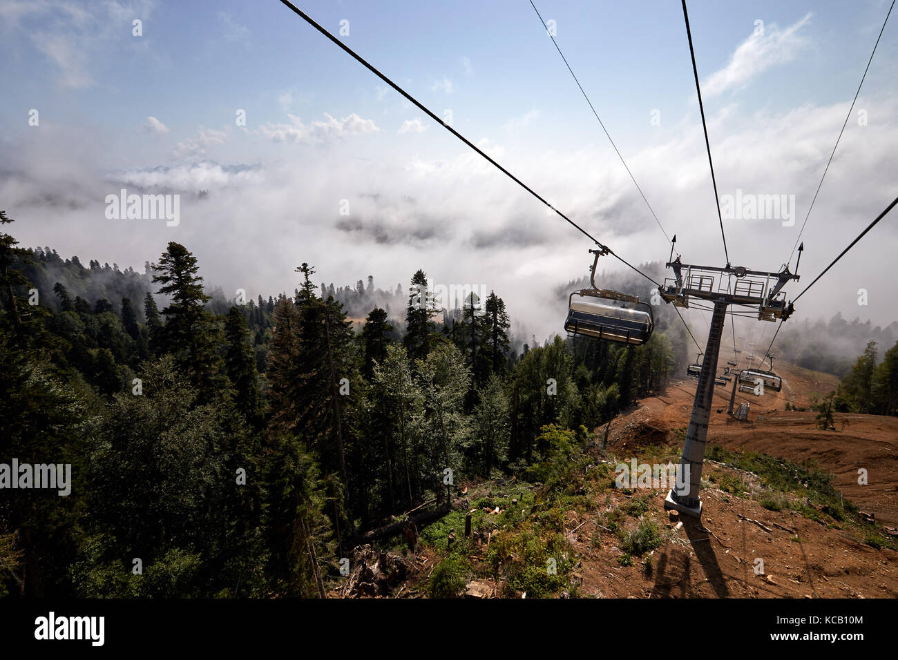 Rope Way View View from top of ropeway with multiple seats and stretched cables above ...