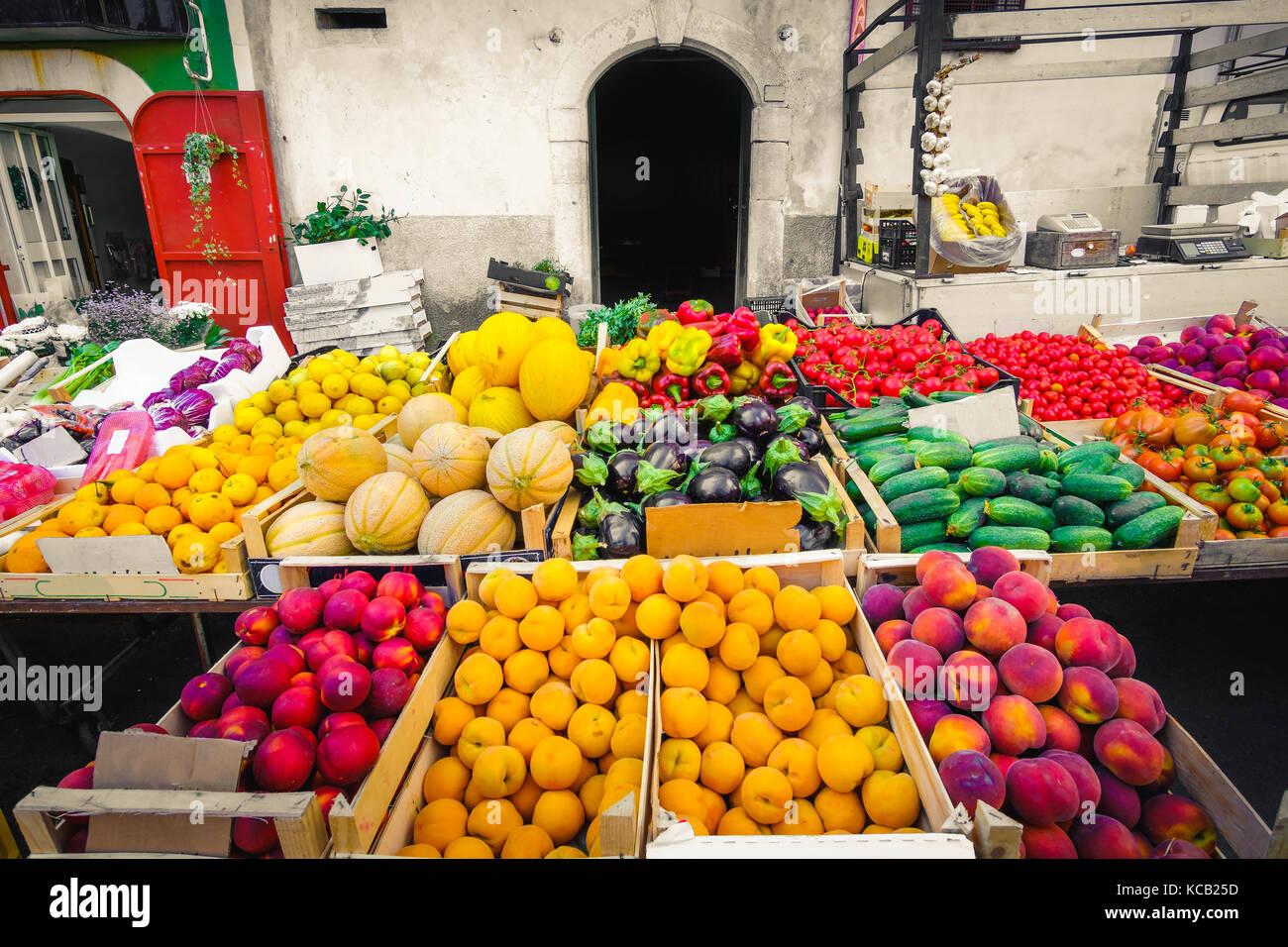 local market greengrocery food miles fruits and vegetable shelves Stock Photo