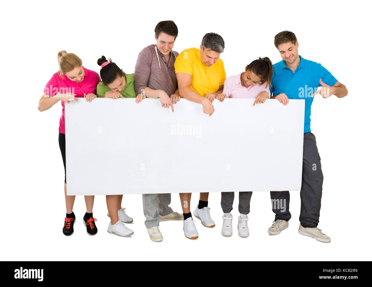 Group Of Smiling People Holding Blank Banner In Front Of A White ...