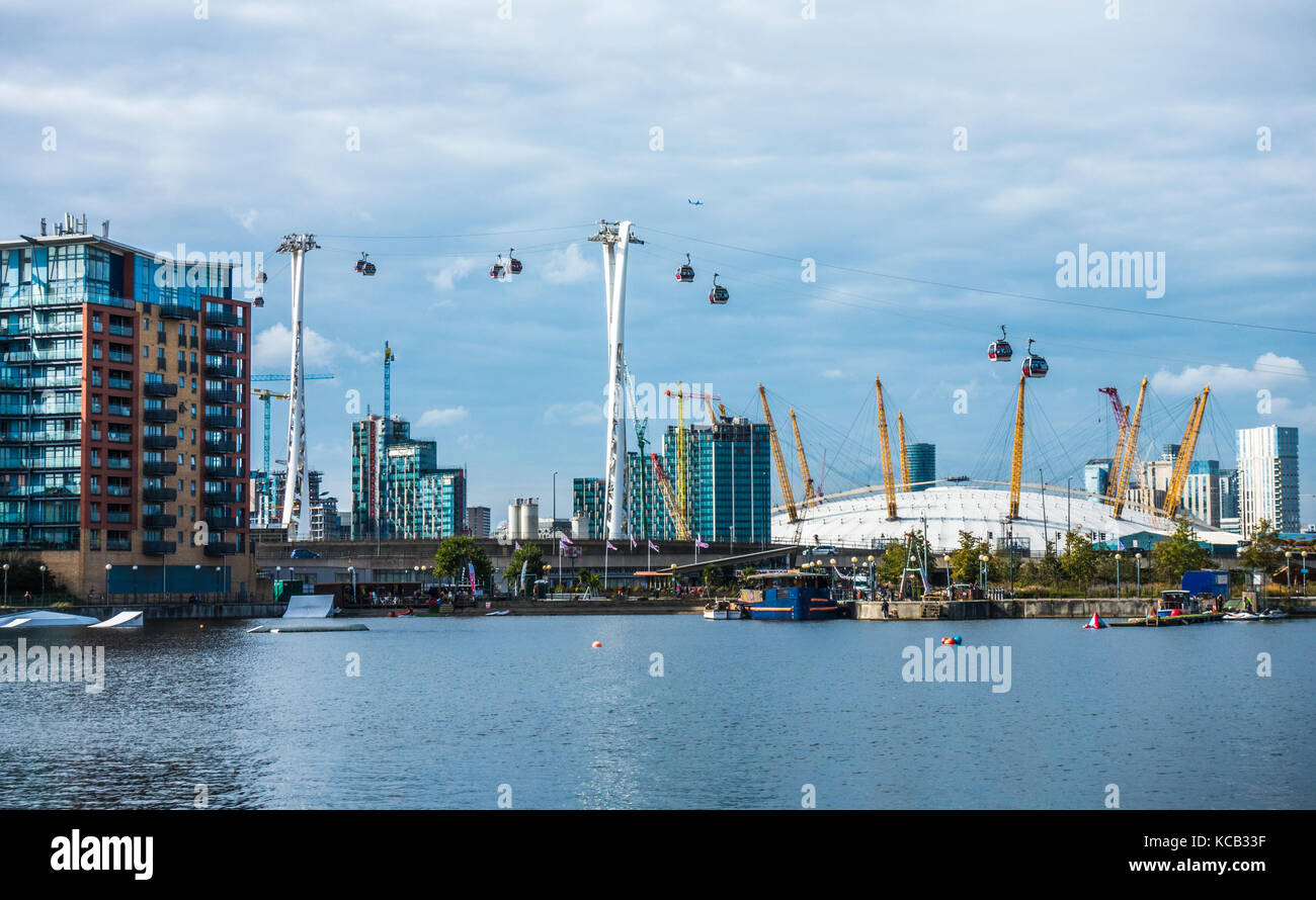 Scene across Royal Victoria Dock (mainly used for water sports) to Greenwich, with the O2 Arena, cable cars and apartment blocks, London, England, UK. Stock Photo