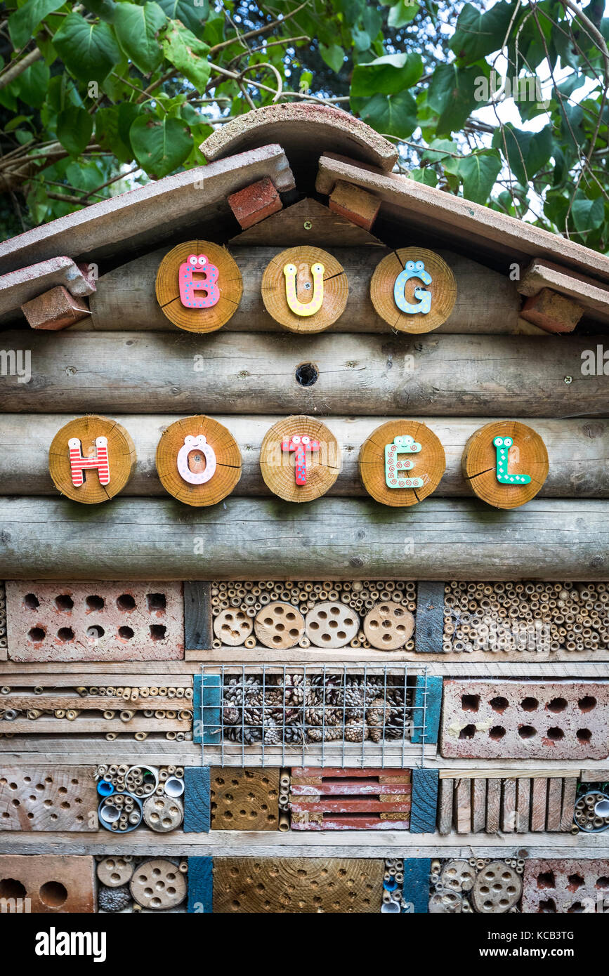 A bug hotel in a communal garden Stock Photo