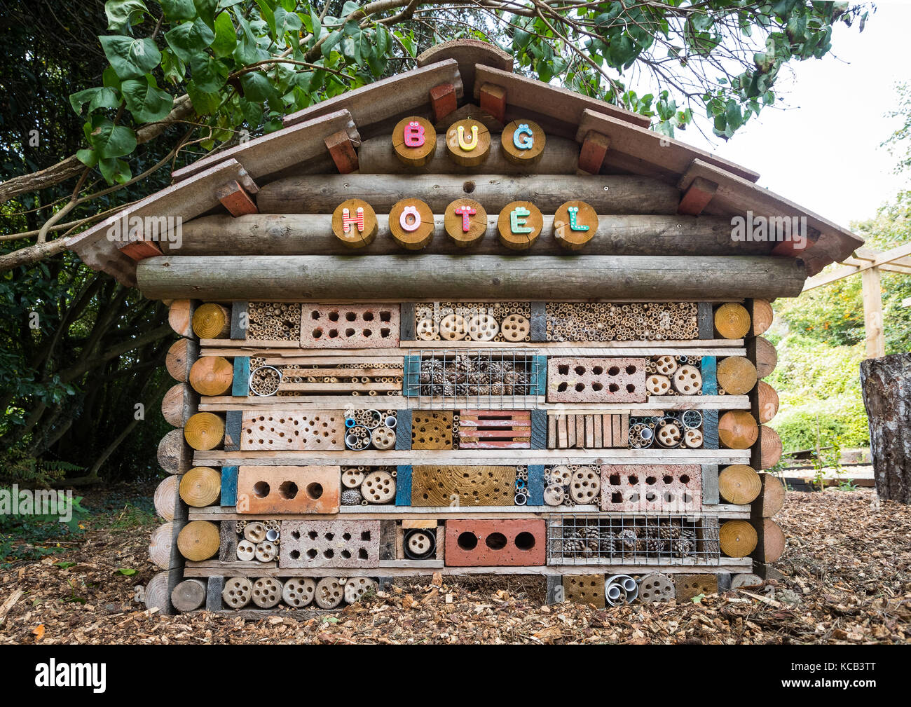 A bug hotel in a communal garden Stock Photo