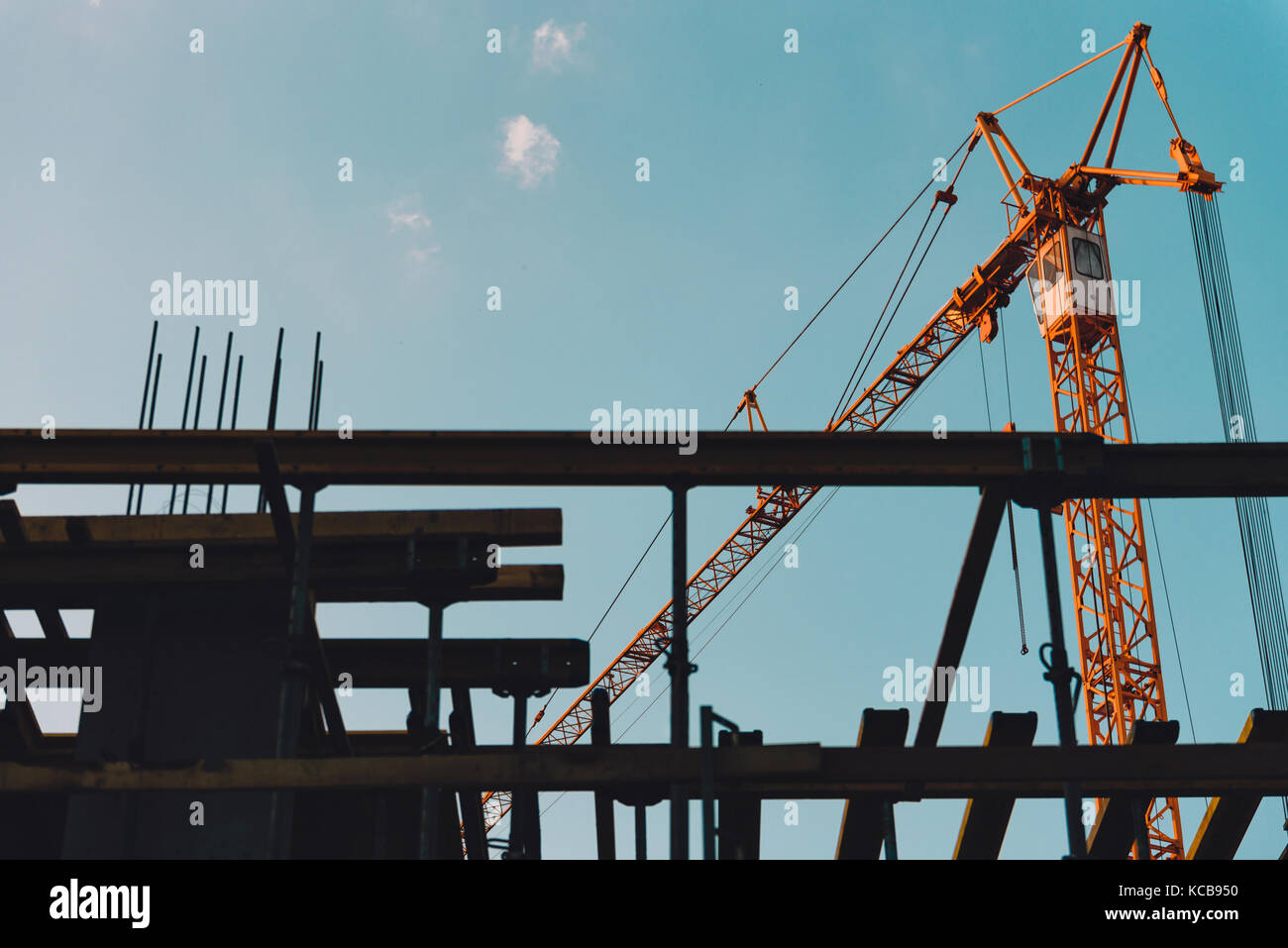 Construction site crane lifting concrete hi res stock photography and